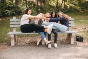 4 girls hugging on the bench